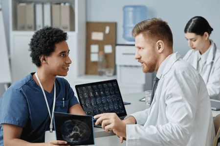 Travel Radiology Tech Collaborating with Healthcare Professionals 450x300