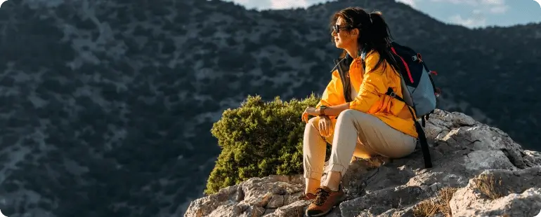 A travel physical therapist enjoying an outdoor adventure in the mountains