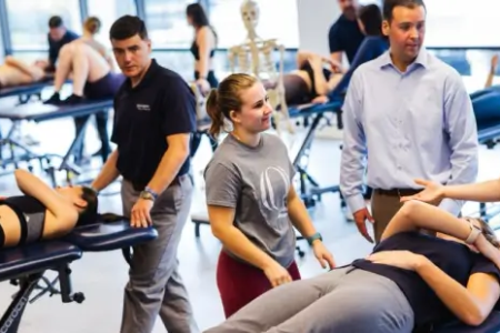 DPT Students in Classroom Training for Physical Therapy Degree 450x300
