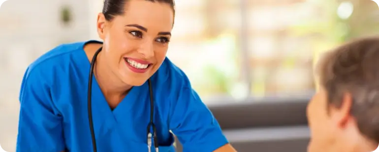 Medical surgical travel nurse providing care to a patient during a well-paid travel nursing assignment