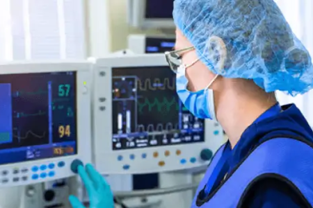 ICU nurse tracking patient vitals during CCRN certification process 450x300